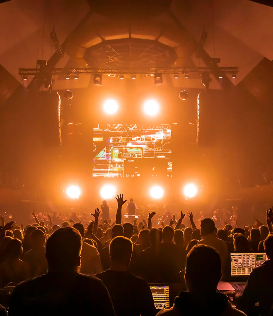 Fans dancing shoulder to shoulder at a SYNTHONY show